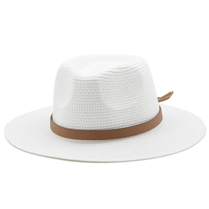 Detail of white woven straw panama hat with elegant brown leather band decoration