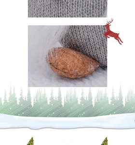 Close-up of grey knitted fabric texture with button and brown felt feet on a Christmas gnome