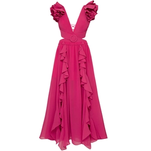 Detailed view of layered ruffles and waist cutout on a fuchsia one-piece swimsuit dress