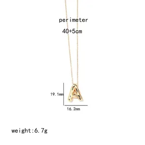 Detail view of 3D gold initial A pendant necklace with polished finish on a slim chain