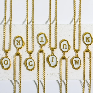 18K gold plated stainless steel initial necklaces with white enamel on stone surface