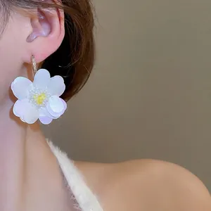 Elegant floral zircon earrings with white sequin petals and golden metal hooks for women