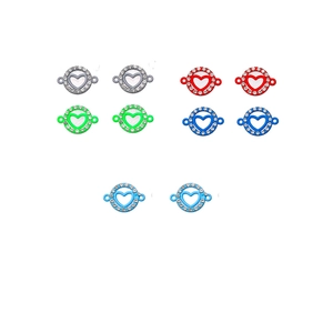 Macro view of colorful heart-shaped rhinestone connectors in silver and blue metal