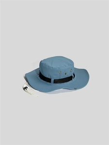 Detail view of the outdoor sun hat showing metal vents and adjustable drawstring buckle