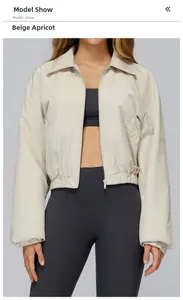 Close-up of cream beige windproof sports jacket with adjustable elastic hem detail