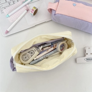 Macro shot showing high-capacity fabric pencil case interior with smooth zipper