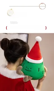 Close-up of soft green Christmas tree plush toy with a cute face and Santa hat