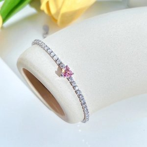 Close-up of pink heart-shaped gemstone tennis bracelet in S925 sterling silver