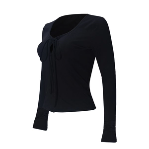 Close-up of black V-neck long-sleeve crop top with lace-up front detail