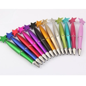 Close-up of star-shaped pen caps arranged in a colorful fan layout on white background