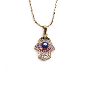 Golden Hamsa Hand necklace featuring colorful zircon stones and a blue evil eye pendant
