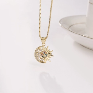 Golden sun and moon pendant necklace with micro-set colorful zircons on white background