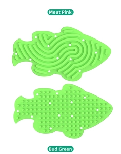 Detail of fish-shaped silicone sensory activity board with maze and granule textures