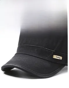 Detail of black cotton military cap featuring a metal logo plate and reinforced stitching