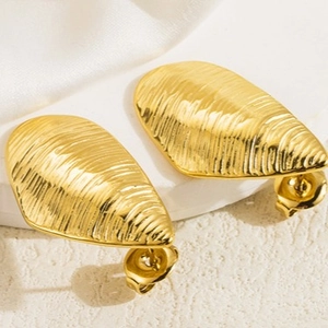 Minimalist gold irregular leaf earrings with textured surface and shell pattern details