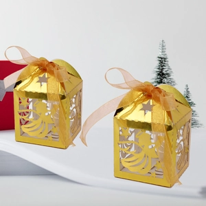 Golden laser-cut Christmas candy box with angel pattern and matching ribbon