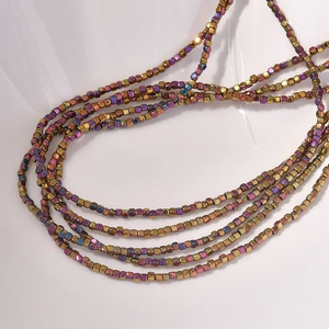 Close-up of 2mm square hematite beads with rainbow metallic luster for DIY jewelry making