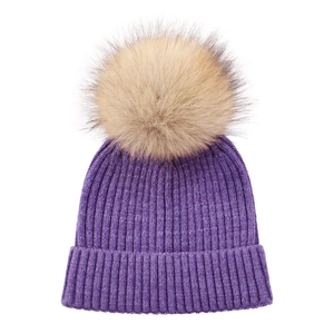 Detail of purple ribbed knit child hat featuring a large fluffy light brown faux fur pompom
