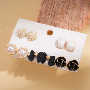 Ten-piece vintage stud earring set with pearls, bowknots and flowers on display card