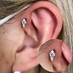 Macro detail of G23 titanium labret stud with rhombus zircon on ear cartilage piercing