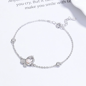 Elegant 925 sterling silver butterfly bracelet with pearls and small diamonds on white base