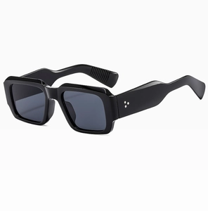 Detailed 3/4 view of black square oversized sunglasses with triple metal rivets on frame