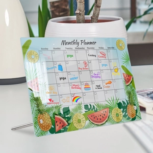 Macro shot of acrylic monthly planner with fruit patterns and sturdy metal stand