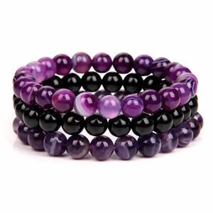 Detailed close-up of 8mm purple amethyst and black hematite natural stone beaded bracelets