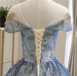 Detailed back view of light blue evening gown featuring adjustable lace-up corset ties