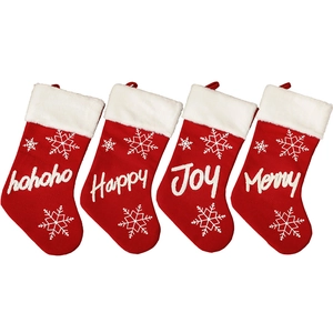 Set of 4 red knitted Christmas stockings with white embroidery and plush faux fur cuffs