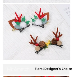 Detail of Christmas reindeer antler hair clips with pine cones and red berries