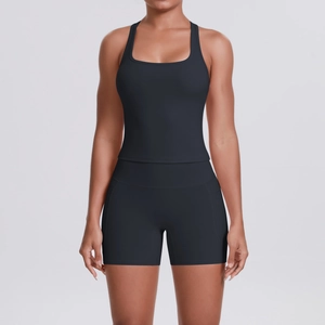 Front view of a two-piece black racerback sports tank top and high-waist yoga shorts set