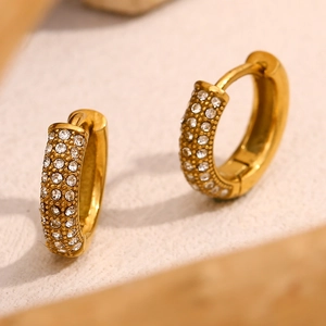 Macro shot of 18K gold plated hoop earrings with full pave cubic zirconia detail