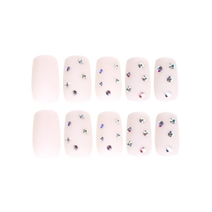 French matte nude pink press-on nails with rhinestone accents in a short square shape