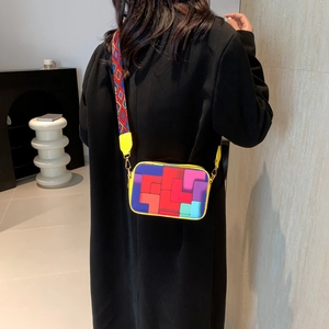 Modern colorful patchwork crossbody camera bag with geometric blocks and wide shoulder strap