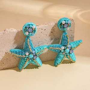 Starfish earrings with turquoise beads and faux pearls for a luxury beach vacation look