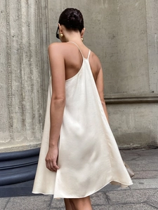 Elegant champagne satin backless mini dress with thin straps and draped silhouette