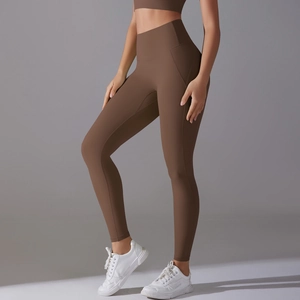 Detail of high-waisted seamless chocolate yoga pants with ergonomic stitching lines