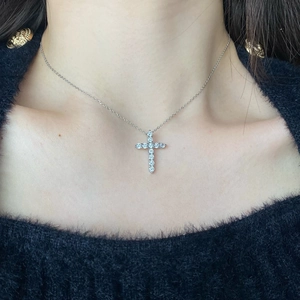 Exquisite S925 silver cross pendant necklace with zircon inlay worn on model's neck