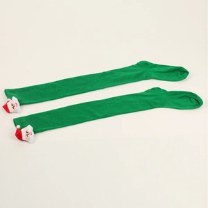 Detail of green knit Christmas over-the-knee socks featuring 3D Santa Claus doll decorations