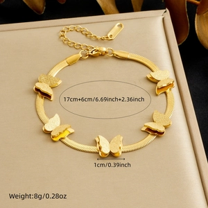 Detail shot of gold-plated butterfly bracelet with frosted texture and snake chain link