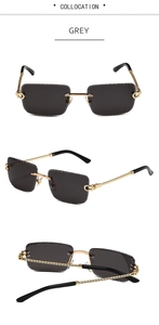 Detail of grey rimless sunglasses featuring twisted metal temples and C-hinge design