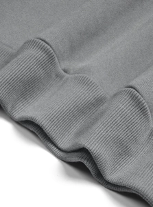 Detailed close-up of gray ribbed cuffs on a men's vintage half-zip sweatshirt