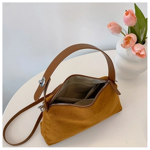 Interior view of caramel suede tote bag showing zipper pockets and spacious compartment