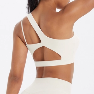 Detail of asymmetric hollow back design on ivory double-sided brushed sports bra