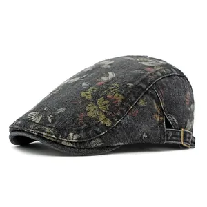 Vintage floral denim newsboy cap with adjustable metal buckle and dark blue texture
