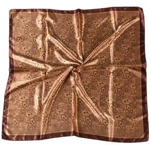 Detailed texture of a bronze paisley satin square scarf showing smooth silk-like finish