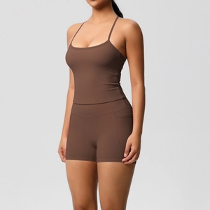 Detail of high-waisted dark brown yoga shorts with functional side pockets for sports