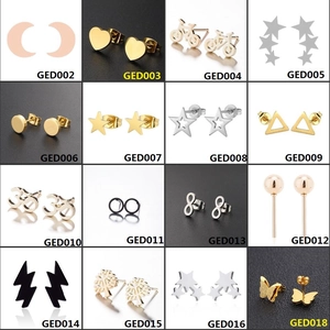 Detail grid of small stainless steel stud earrings in heart star and moon shapes