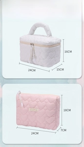 Detailed size comparison of white and pink heart-quilted vanity bags with dimensions